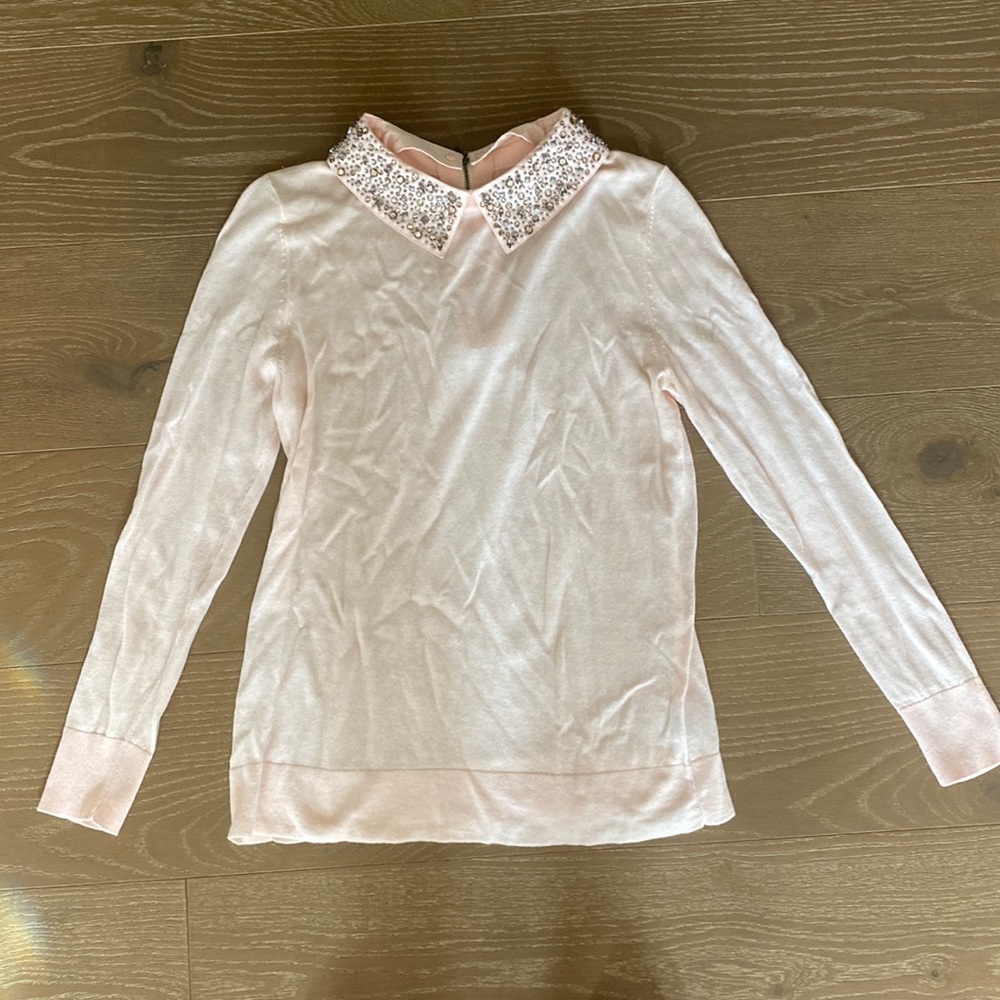 Never worn, but sat in my closet for a few years, bedazzled collar, zips up back